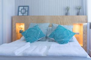 Llit o llits en una habitació de Livemalaga Boutique Apartments