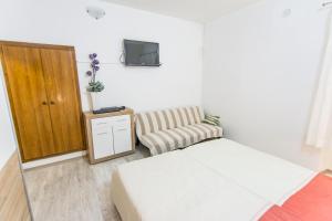 Postel nebo postele na pokoji v ubytování Apartment Sali Dugi Otok