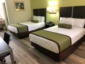 Ліжко або ліжка в номері Southern Inn Minden