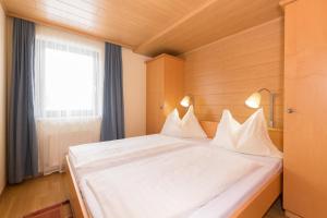 Postel nebo postele na pokoji v ubytování Appartement Roland