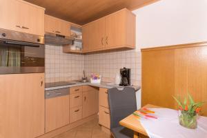 Kuchyň nebo kuchyňský kout v ubytování Appartement Roland