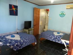 Ένα ή περισσότερα κρεβάτια σε δωμάτιο στο Hotel Margarita Sierpe