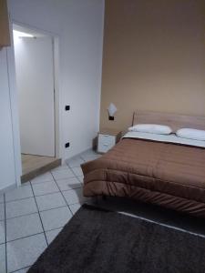 Postel nebo postele na pokoji v ubytování Al cortile