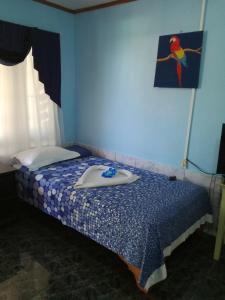 Ένα ή περισσότερα κρεβάτια σε δωμάτιο στο Hotel Margarita Sierpe