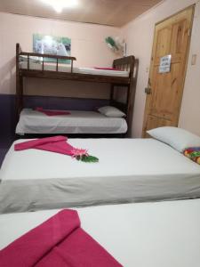 Ένα ή περισσότερα κρεβάτια σε δωμάτιο στο Hotel Margarita Sierpe