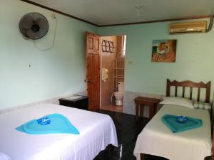 Ένα ή περισσότερα κρεβάτια σε δωμάτιο στο Hotel Margarita Sierpe