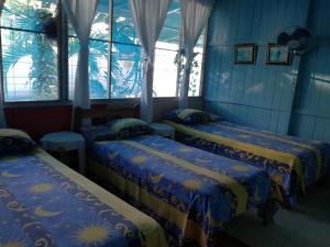 Ένα ή περισσότερα κρεβάτια σε δωμάτιο στο Hotel Margarita Sierpe