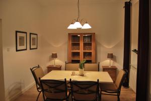 a dining room with a table and chairs at Ferienwohnung Stricker Typ E in Bad Sachsa