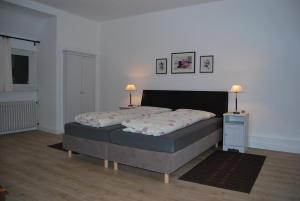 Ένα ή περισσότερα κρεβάτια σε δωμάτιο στο Ferienwohnung Stricker Typ E