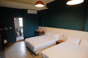 Letto o letti in una camera di Xin Yuan Hang Homestay