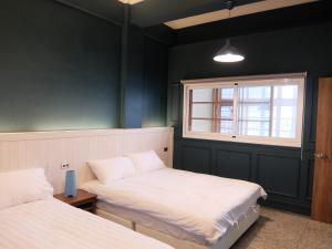 Letto o letti in una camera di Xin Yuan Hang Homestay