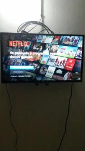 a flat screen tv sitting on top of a table at Mar azul 401 in San Felipe de Puerto Plata