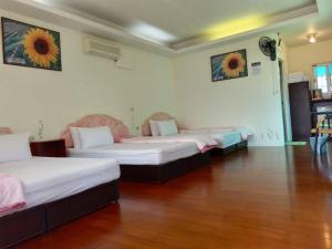 Ліжко або ліжка в номері Chin Shan B&B