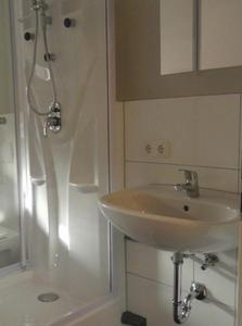 a bathroom with a sink and a shower at CityZimmer Eltmann in Eltmann