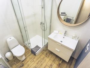 a bathroom with a shower and a toilet and a sink at No.3 Apartment Link-To-Happiness in Klaipėda