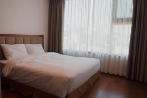 Postel nebo postele na pokoji v ubytování Vabien Suite 1 Serviced Residence