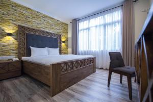 Postel nebo postele na pokoji v ubytování Wifi Boutique Hotel