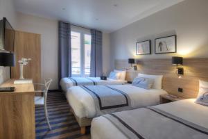 Postel nebo postele na pokoji v ubytování Hotel Paganini