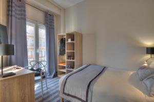 Postel nebo postele na pokoji v ubytování Hotel Paganini