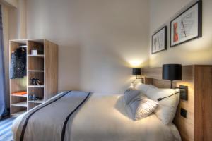 Postel nebo postele na pokoji v ubytování Hotel Paganini