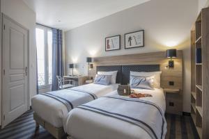 Postel nebo postele na pokoji v ubytování Hotel Paganini