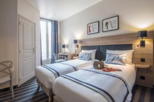 Postel nebo postele na pokoji v ubytování Hotel Paganini