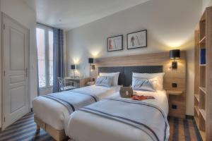 Postel nebo postele na pokoji v ubytování Hotel Paganini