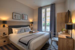 Postel nebo postele na pokoji v ubytování Hotel Paganini