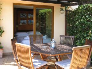 a table and four chairs on a patio at Hotel Argentina in Santa Margherita Ligure