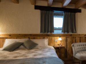 Postel nebo postele na pokoji v ubytování Chambres d'hôtes La Moraine Enchantée