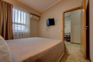 Una cama o camas en una habitación de Bishkek Boutique Hotel