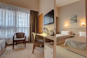 Ένα ή περισσότερα κρεβάτια σε δωμάτιο στο Bishkek Boutique Hotel +28 φωτογραφίες