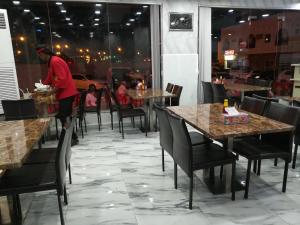 A restaurant or other place to eat at Tanuf Residency Hotel