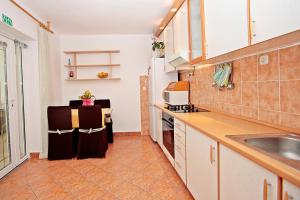 Kuchyň nebo kuchyňský kout v ubytování Apartman Diana