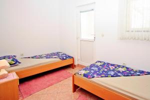 Postel nebo postele na pokoji v ubytování Apartman Diana