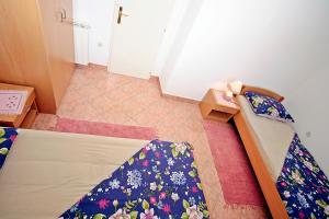 Postel nebo postele na pokoji v ubytování Apartman Diana