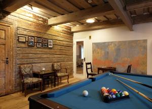 a billiard room with a pool table in a house at Meke in Mustkalni