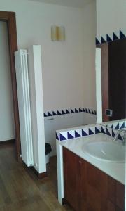 a bathroom with a sink and a mirror at B & B Paradiso in Loreto