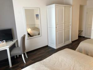 Postel nebo postele na pokoji v ubytování Hotel Toskana