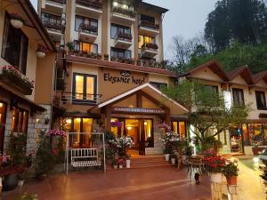 a large building with a store in front of it at Sapa Elegance Hotel in Sapa