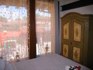 Postel nebo postele na pokoji v ubytování B&B I fiori di Marianna