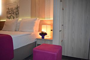 Letto o letti in una camera di Hotel Cosmopolit