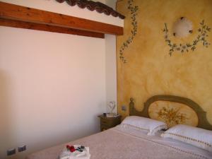 Postel nebo postele na pokoji v ubytování B&B I fiori di Marianna
