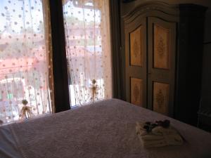 Postel nebo postele na pokoji v ubytování B&B I fiori di Marianna