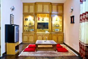 A television and/or entertainment center at Swagat homestay