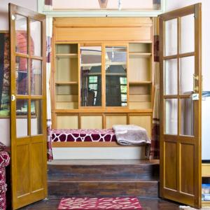 a room with an open door with a bench inside at Swagat homestay in Kathmandu