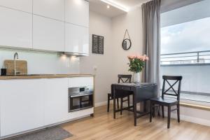 Kuchyňa alebo kuchynka v ubytovaní Elite Apartments Marine Suite