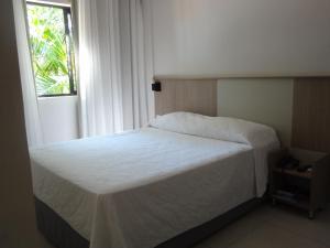 Cama ou camas em um quarto em Iguassu Express Hotel