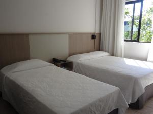 Cama ou camas em um quarto em Iguassu Express Hotel
