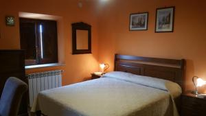 Postel nebo postele na pokoji v ubytování B&B A Robba de Pupi